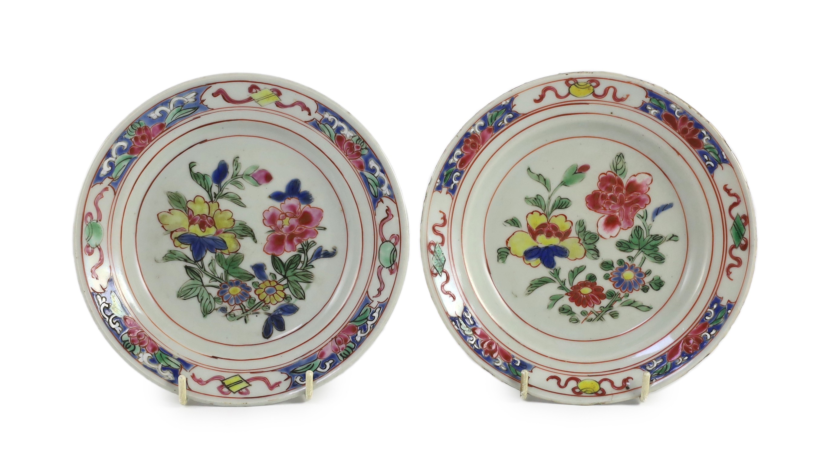 A pair of Chinese famille rose fencai small plates, early Yongzheng period, 16 cms diameter, 16cm diameter